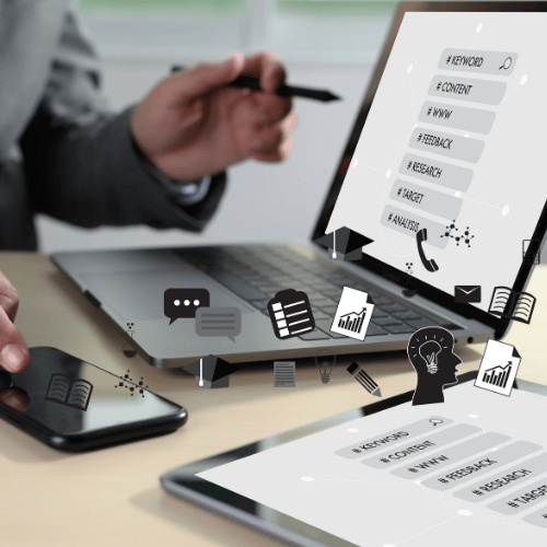 Person working across multiple devices with SEO elements on screen, highlighting the importance of on-page SEO for local and growing businesses.